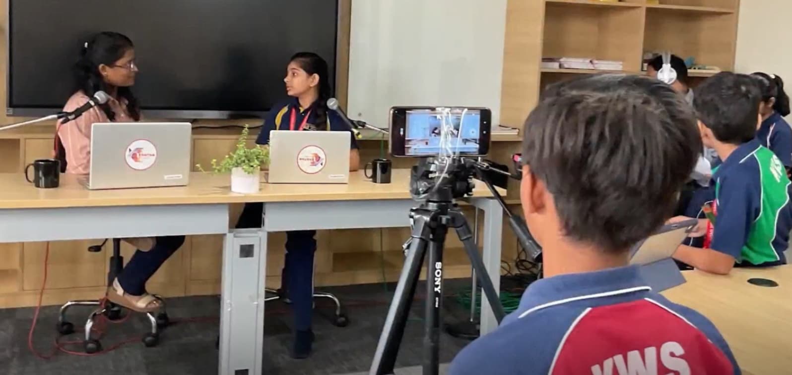 Leading Through Voice — Students take the mic and lead conversations.