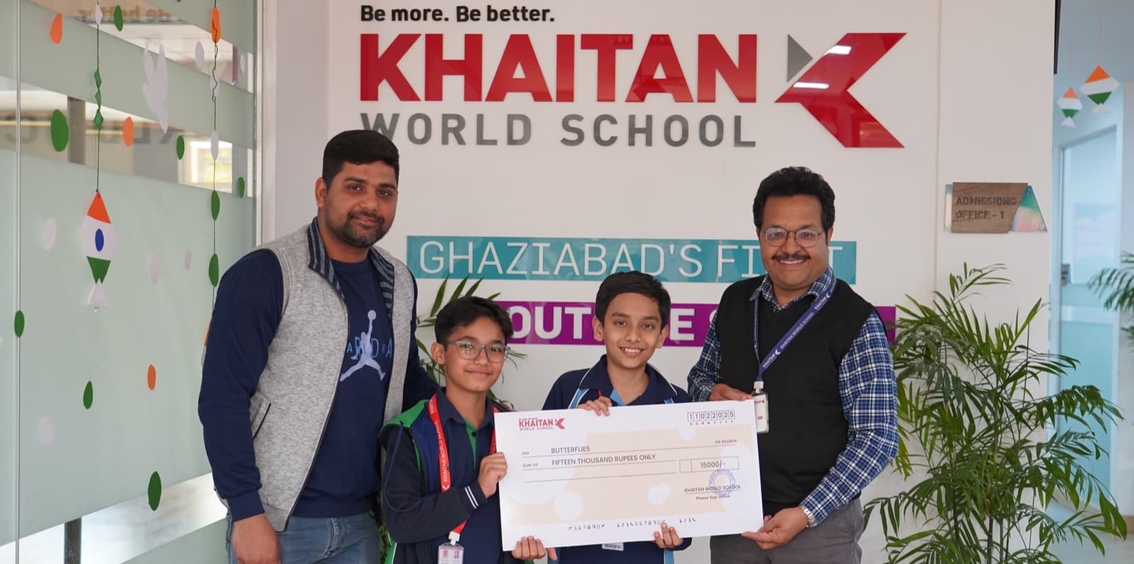 Handing over a cheque to the Butterflies NGO.