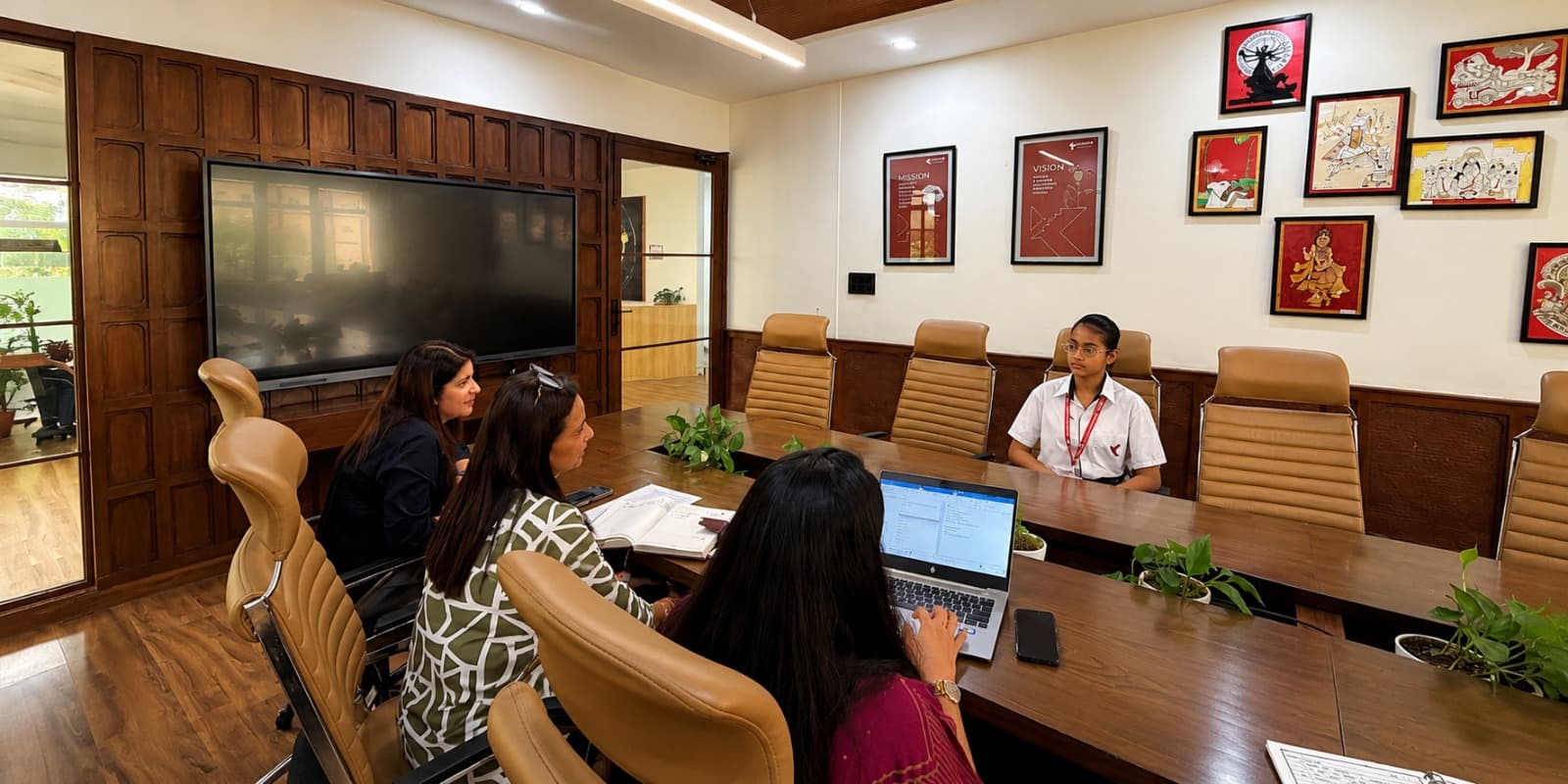 Candidates face the interview panel for leadership roles.