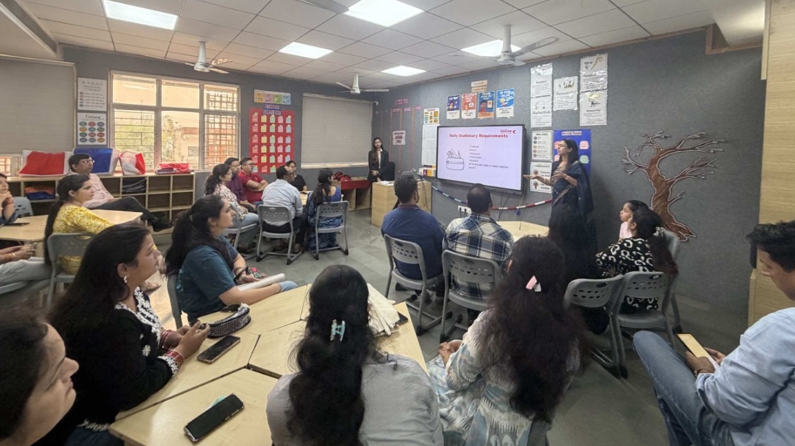 Parents at a Khaitan World School orientation session in a classroom